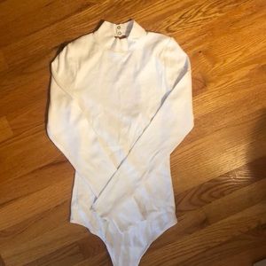 Turtle neck, open-back body suit